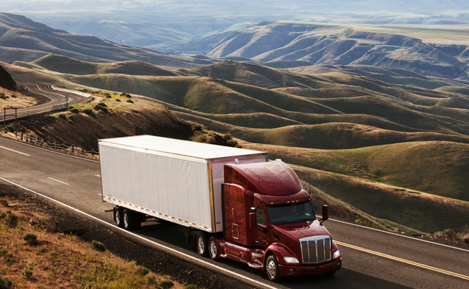Class 8 semi truck descending a grade using its engine brake