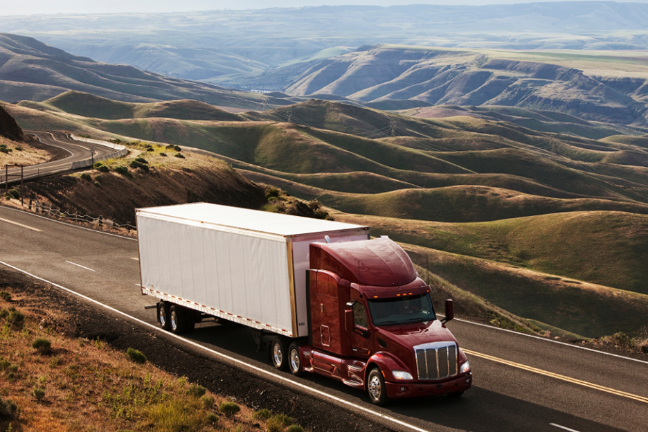 Class 8 semi truck descending a grade using its engine brake
